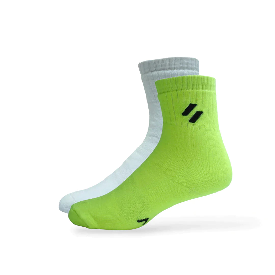 Women’s athletic socks on foot – crew-length, perfect for basketball and tennis – with ribbed cuff and comfort grip - Neon green and white