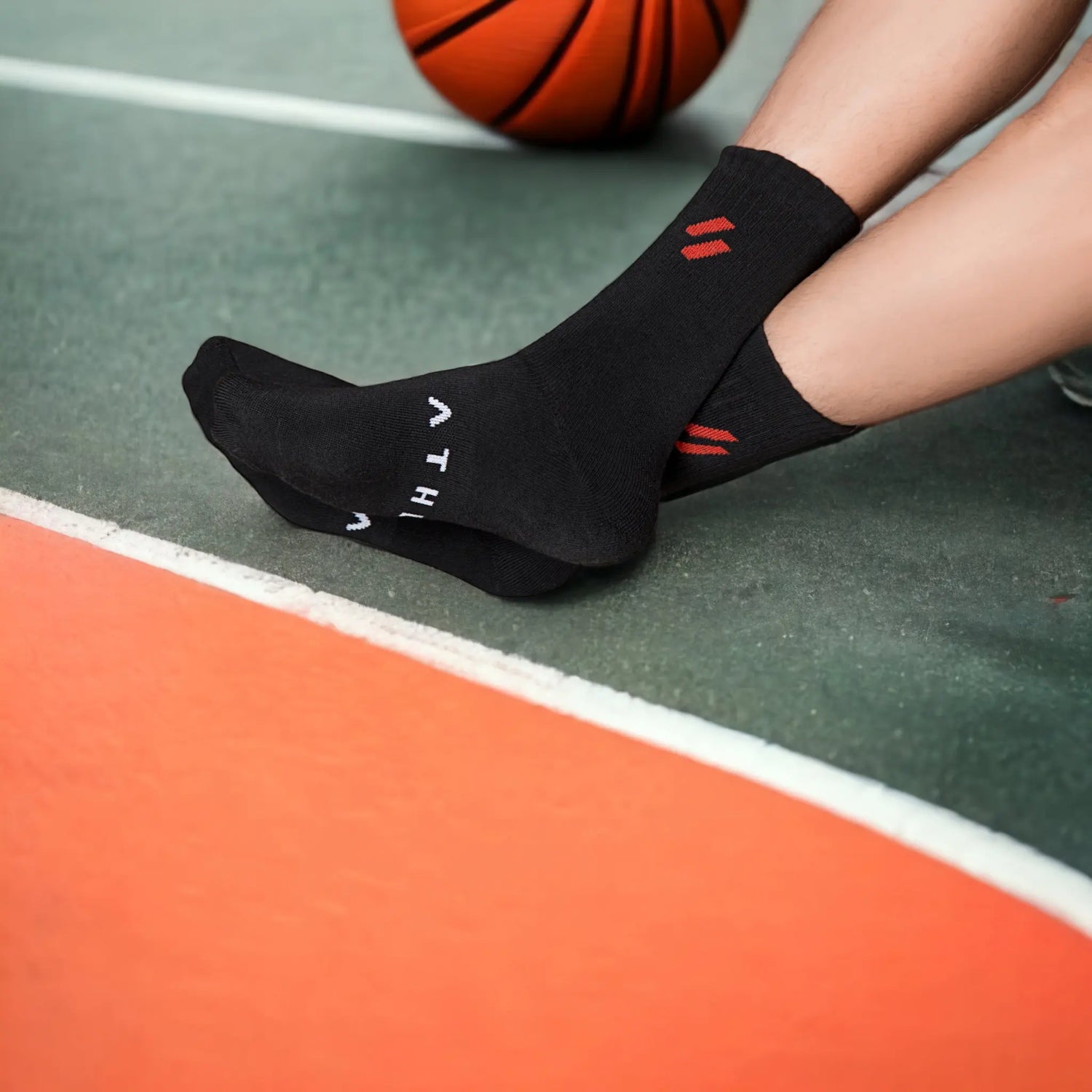 Athlete in black athl socks with anti microbial finish